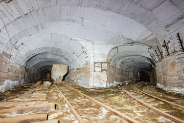 Abandoned old ore mine shaft tunnel passage wagon