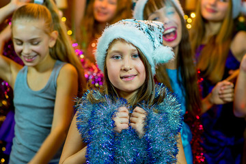 Group of young girls celebrating Christmas. First plan