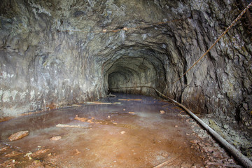 Abandoned old ore mine shaft tunnel passage