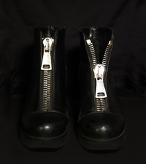 Black shoes on the black background. 