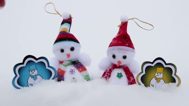 Winter snowmen with pictures under snow