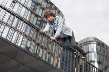 Young man doing parkour in the city