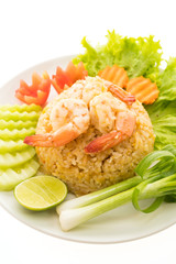 Fried rice with shrimp and prawn on top in white plate