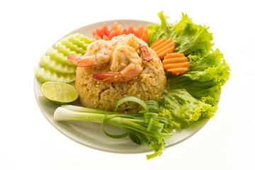 Fried rice with shrimp and prawn on top in white plate