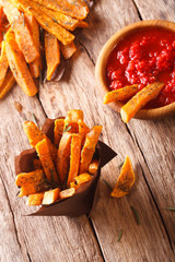 sweet potato fries with rosemary, and ketchup close-up. Vertical, Rustic