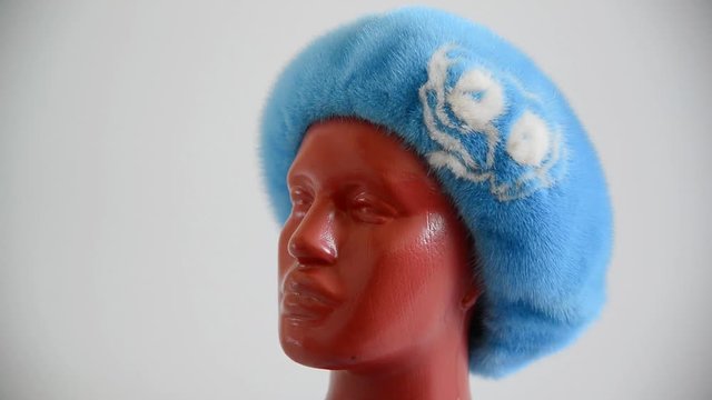 light blue beret from natural mink on mannequin. Side view