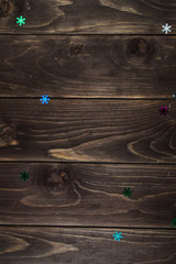 colorful snowflakes on the wooden background