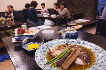 Traditional Japanese meal of sushi and fish head, Tokyo, Honshu Island, Japan