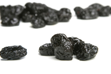 Studio shot of prunes on white background