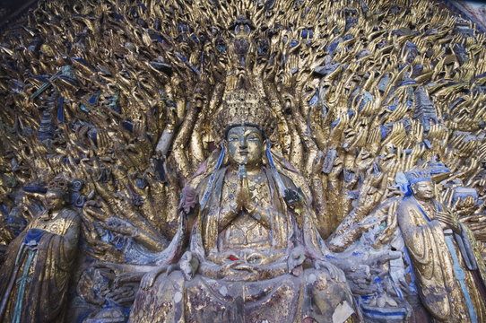 Statue of Avalokitesvara with One Thousand Arms has 1007 arms at the Dazu Buddhist rock sculptures, Chongqing Municipality, China