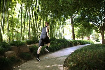 Rear view of man running in park