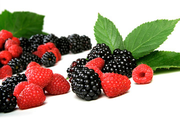 Blackberries and raspberries on white background