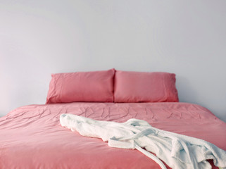 pink bedding on double bed