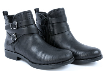 Women blacks boots on a white background