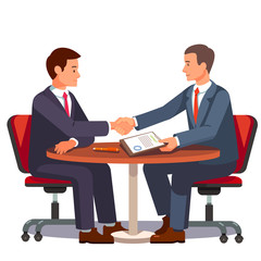 Businessman shaking hands on a signed contract
