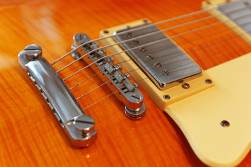 Closeup of the vintage electric guitar. Detail, selective focus.