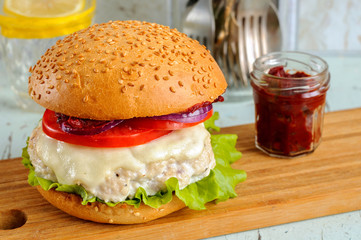 Fresh homemade burger with chicken cutlet, tomato sauce and mozz