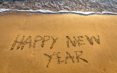 Happy New Year 2017 concept, lettering on the beach