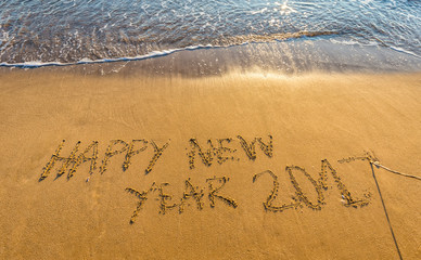 Happy New Year 2017 concept, lettering on the beach