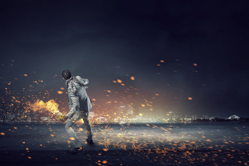 Businessman throwing petrol bomb . Mixed media