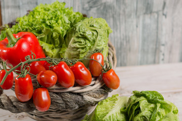 Green fresh roma lettuce salad leaves and roma mini tomatoes - healthy diet