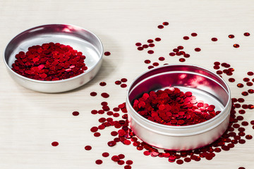 red confetti in jars