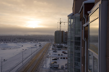 Fototapeta premium Road in the winter street. Evening, sunset