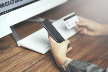 Woman Holding  Card Using Keyboard