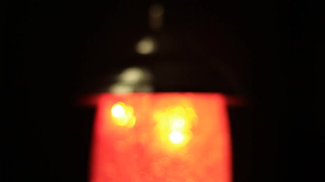 Unfocused night lamp in the darkness
