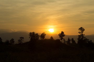 The sunset on the mountains, sun and wind.