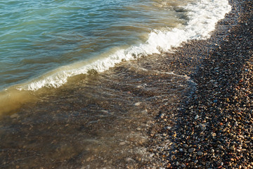 Sea shore with round stones.