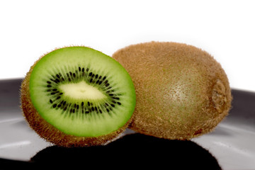 One and half kiwi on the black plate 