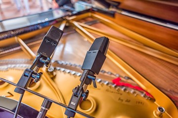 A pair of microphones in stereo for recording a grand piano