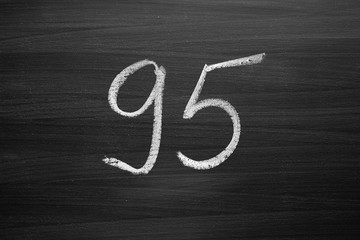number ninety five enumeration written with a chalk on the blackboard