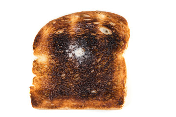 Burned whole grain toast isolated on white background