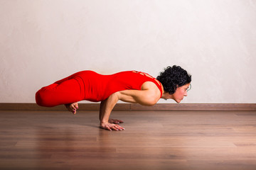 Fototapeta na wymiar Pretty woman practicing yoga at home