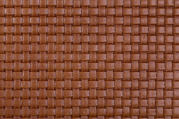 Vintage natural brown braided leather texture.