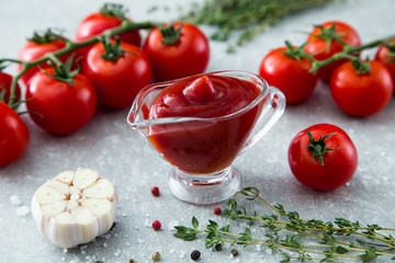 Tomato ketchup sauce with garlic, spices and herbs with cherry t
