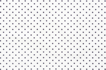 Black dots background over white background.