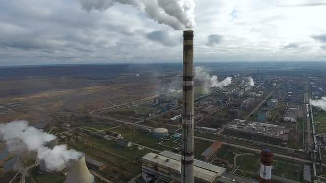 Pollution industry. Smoking power plant in a huge industrial area. 4K.