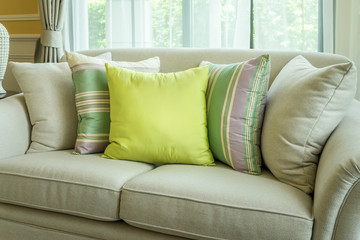Fototapeta na wymiar Sofa with colorful pillows in modern living room