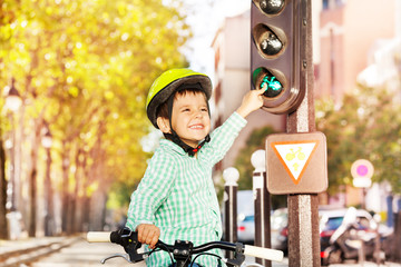 Boy cycling on his bike and learning traffic rules
