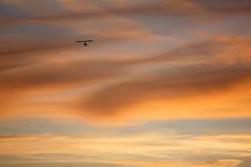 Fototapeta na wymiar Red sky with hang glider