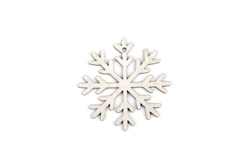 Gorgeous white wooden decoration - snowflake/ star. Adorable winter, Christmas, New Year, event decor made from solid wood. Isolated on white background. Top view. Closeup.