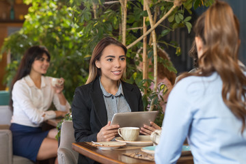 Young Business Woman Drink Coffee Sitting Cafe Table, Asian Girl Hold Tablet Computer Smiling Talking