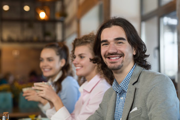 Young Business People Group Drink Coffee Sitting Cafe Table, Friends Hold Cup Smiling Men Women Talking