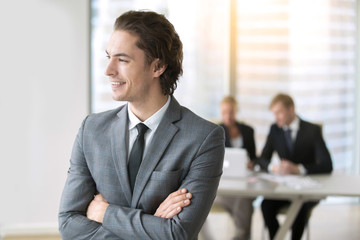 Fototapeta premium Portrait of a young smiling businessman