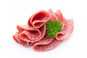 Salami sausage slices isolated on white background.
