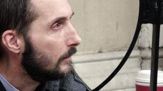Close-up of an homeless begging for money on the street