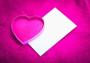 Naklejka na ściany i meble heart with a blank card on red background